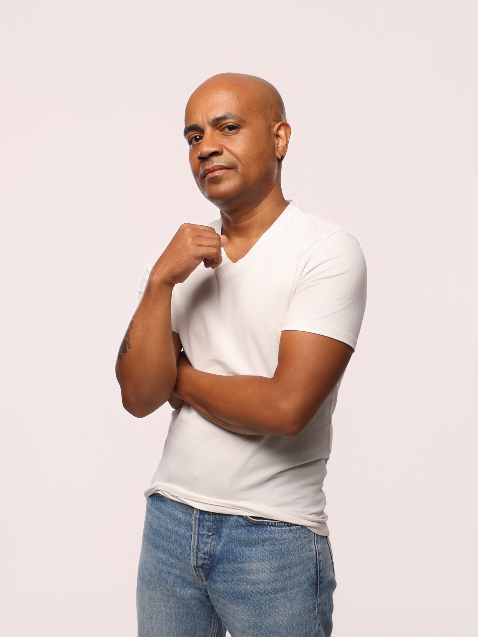 Eric Velez studio portrait in a white T-shirt